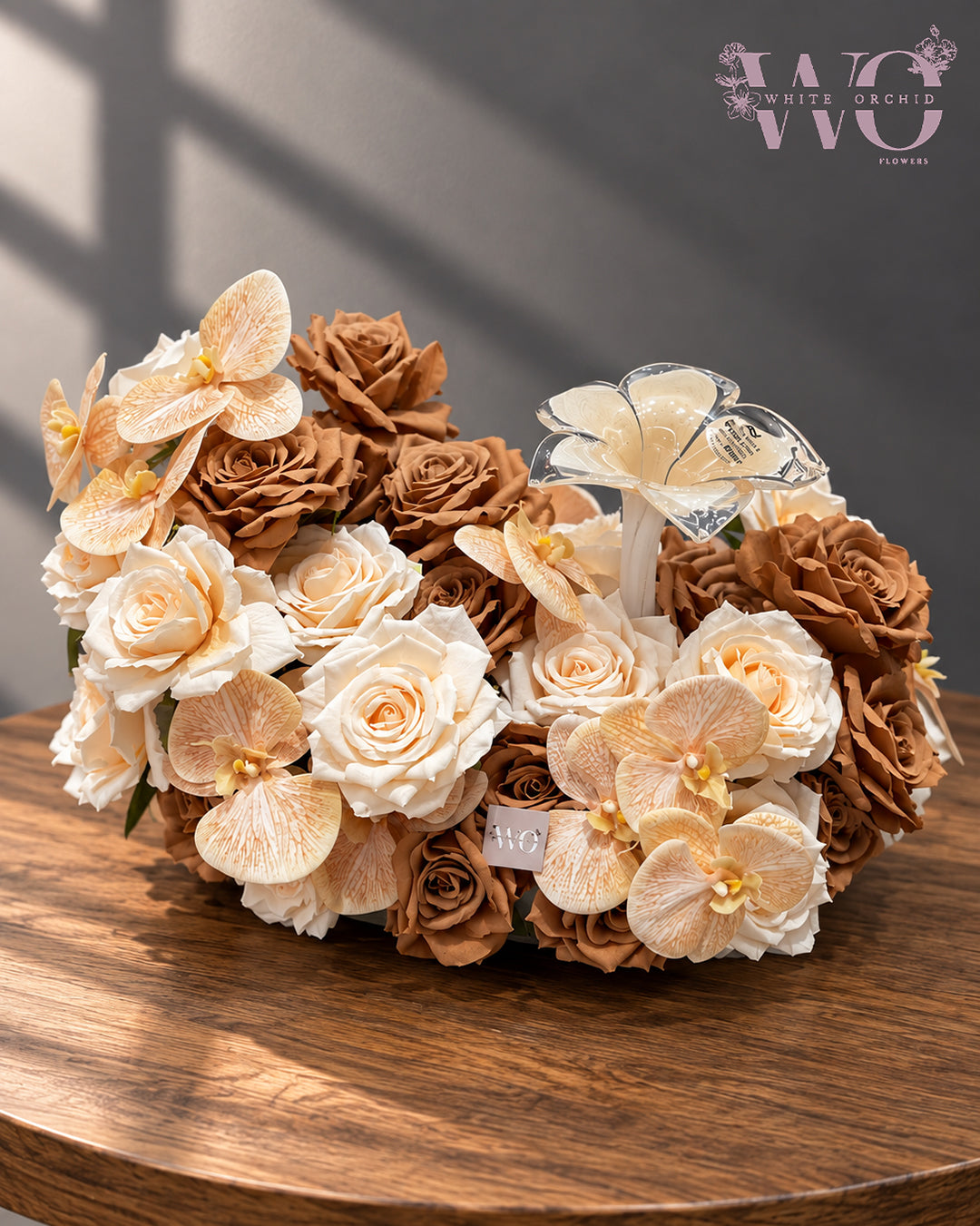 Luxury brown and cream floral arrangement with roses and orchids by White Orchid Flowers