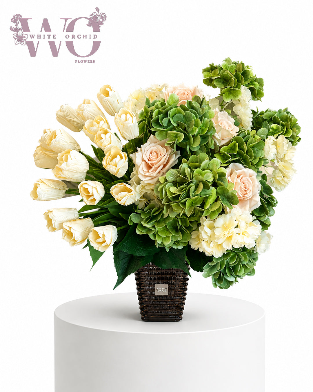 Luxury artificial flower arrangement with cream tulips and green floral accents.