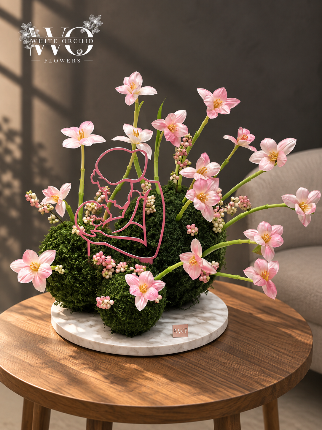 Pink baby girl floral arrangement with delicate flowers, berries and greenery by White Orchid Flowers
