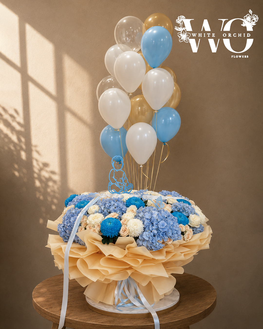 Oversized 1m x 1m baby boy hand bouquet with blue hydrangeas, white roses, blue flowers and balloons