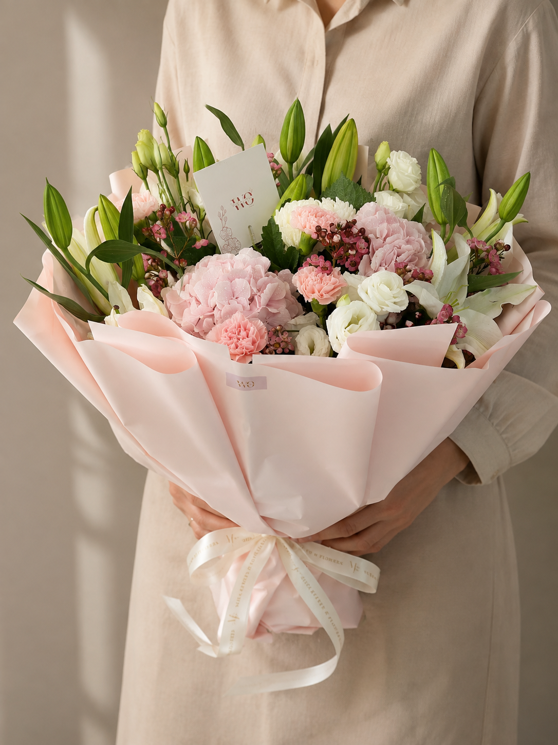 Blush Romance pink and white flower bouquet with hydrangeas, lilies, carnations and fresh greenery