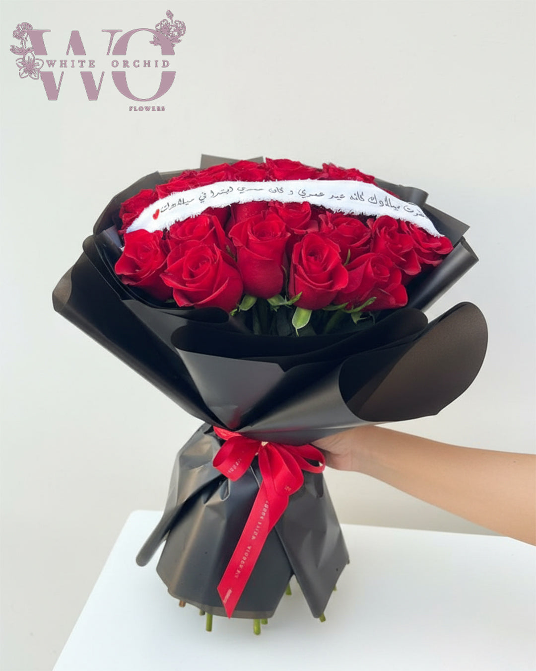 Red rose hand bouquet made with natural fresh roses by White Orchid Flowers – classic romantic bouquet with delivery across all UAE.