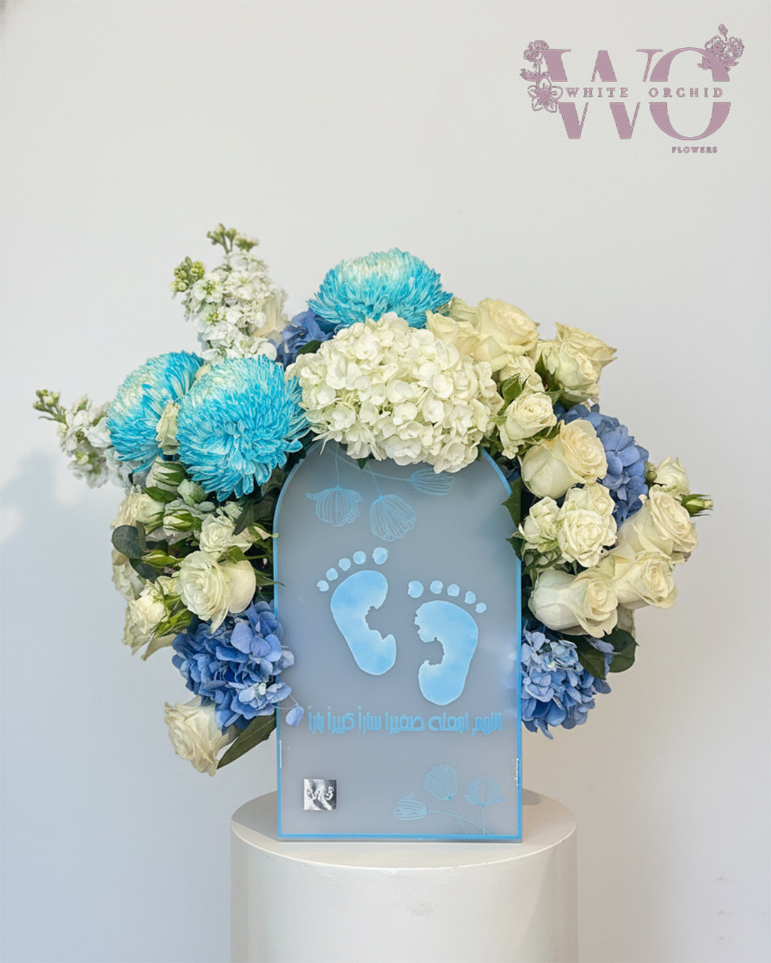 New baby boy flower arrangement made with natural fresh flowers by White Orchid Flowers – elegant newborn gift with delivery across all UAE.