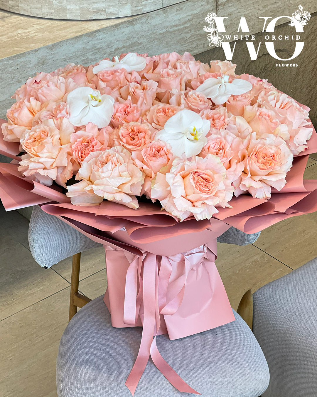 O’Hara rose bouquet with elegant orchid touches by White Orchid Flowers – luxury natural floral arrangement with delivery across all UAE.