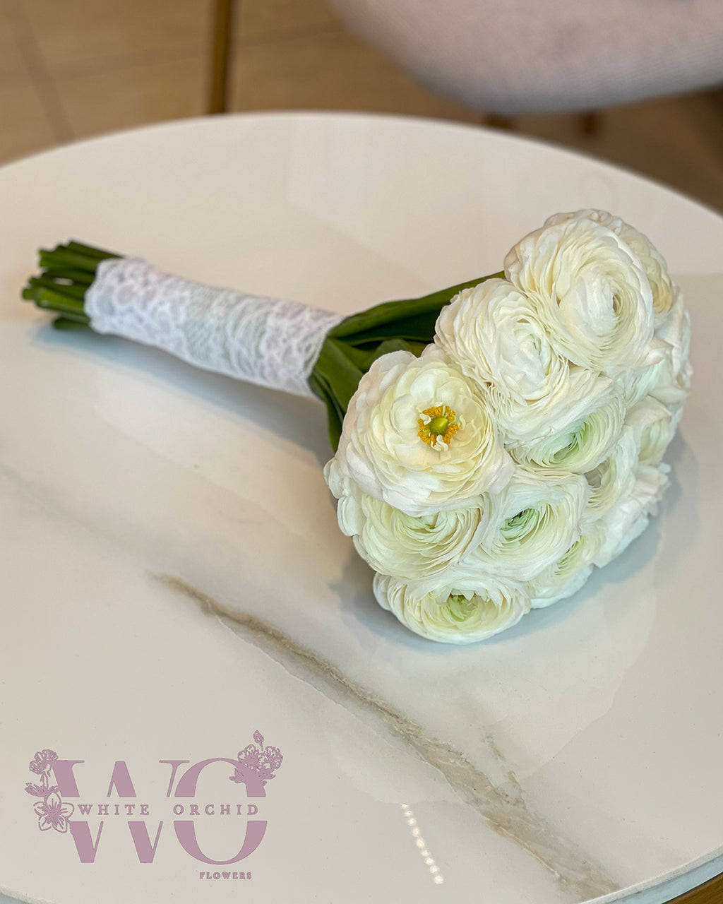 Bridal hand bouquet made with fresh natural white flowers by White Orchid Flowers – elegant wedding bouquet with UAE delivery