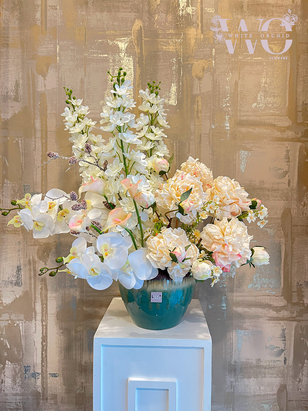 Artificial flower arrangement by White Orchid Flowers – realistic long-lasting decorative design with delivery across all UAE.