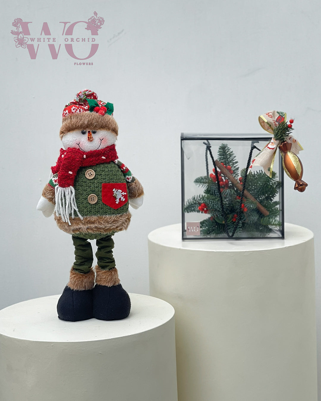 Christmas decor set with winter figure and acrylic box arrangement by White Orchid Flowers – festive seasonal décor with delivery across all UAE