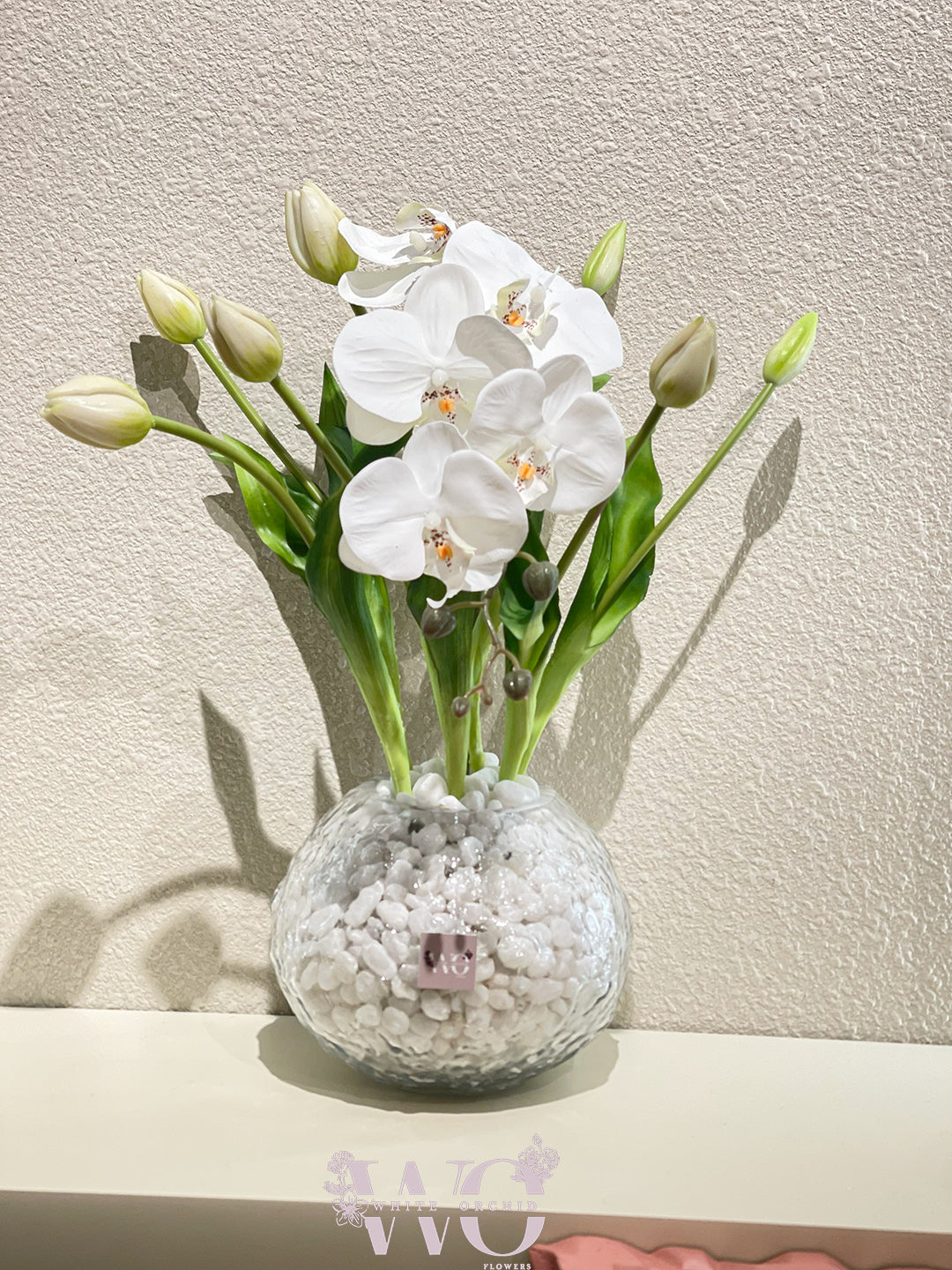 Artificial flower arrangement by White Orchid Flowers – realistic long-lasting decorative design with delivery across all UAE.