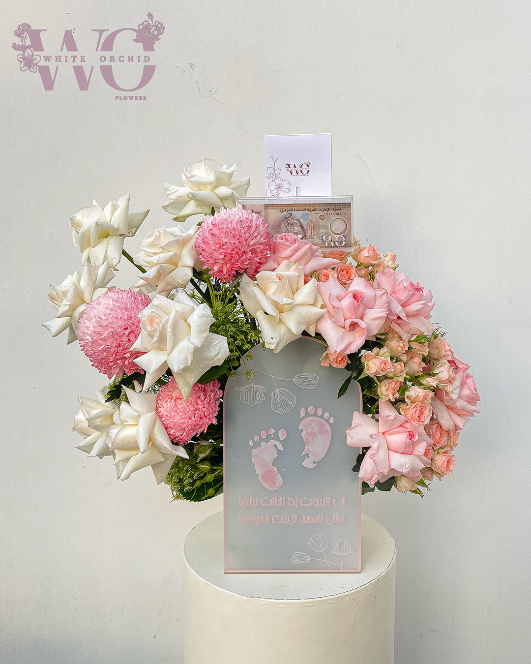 New baby girl flower arrangement made with natural fresh flowers by White Orchid Flowers – elegant newborn gift with delivery across all UAE.