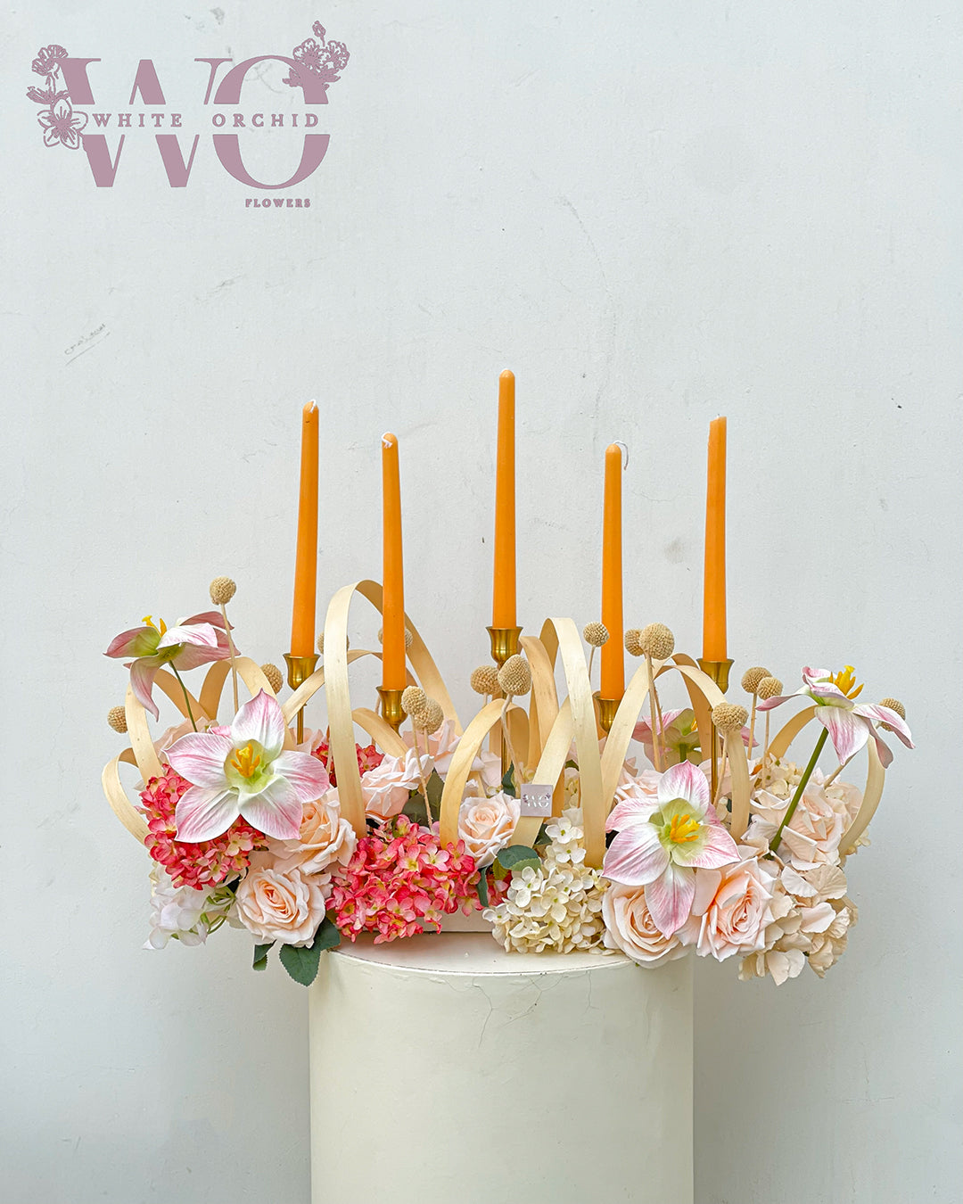 Flower bouquet with candles made with natural fresh flowers by White Orchid Flowers – elegant floral arrangement with delivery across all UAE.