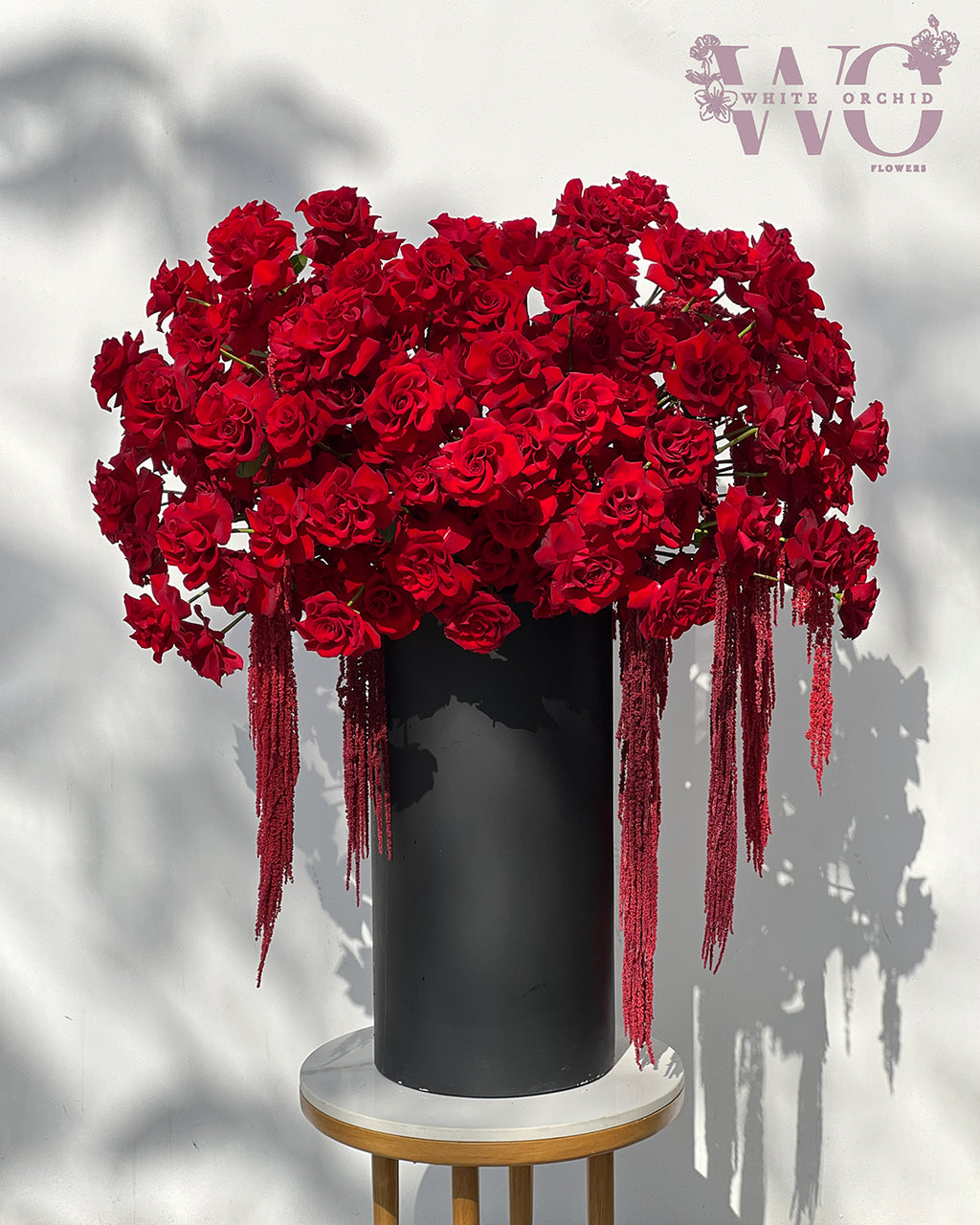 Valentine red roses arranged in a vase by White Orchid Flowers – romantic floral display with delivery across all UAE.