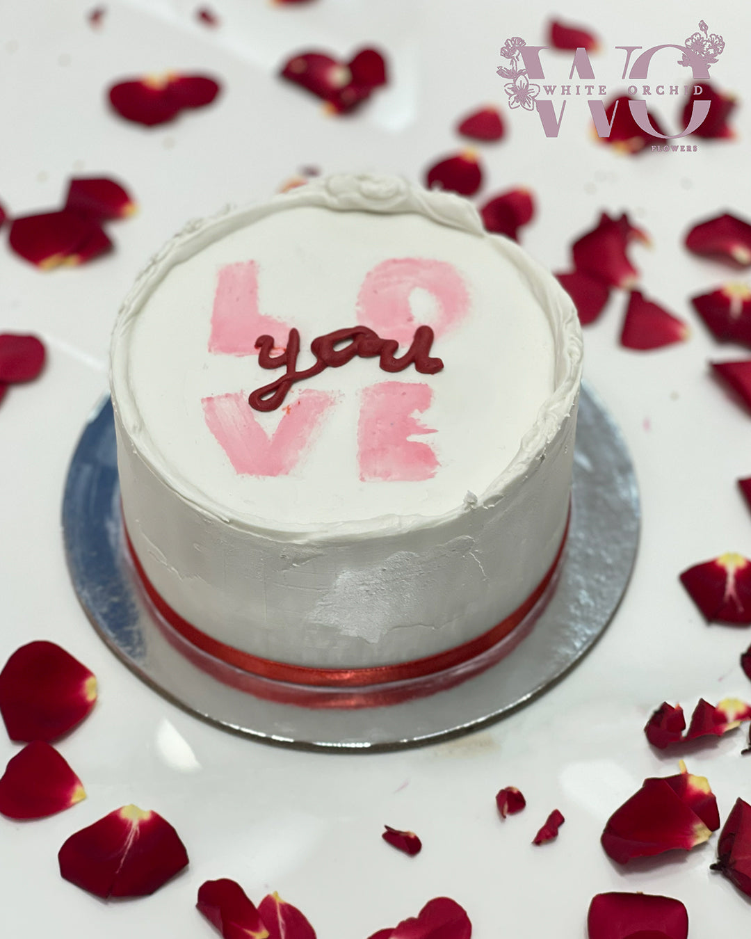 Premium cake by White Orchid Flowers, elegantly presented with delivery across all UAE.
