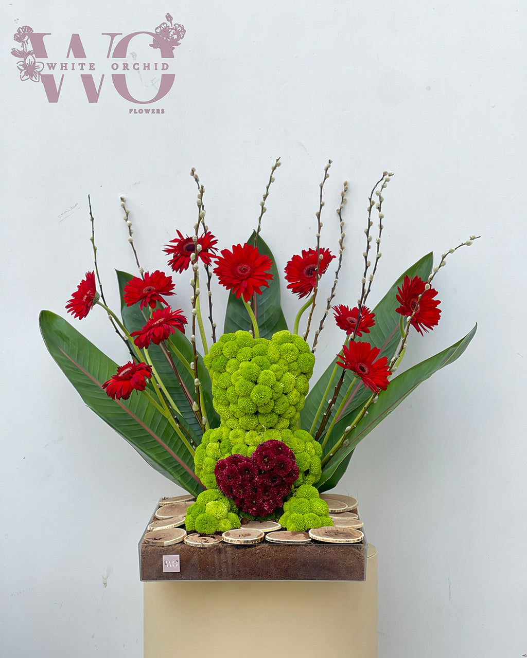 Valentine teddy bear shaped flower bouquet made with natural fresh flowers by White Orchid Flowers – creative romantic floral gift with delivery across all UAE.