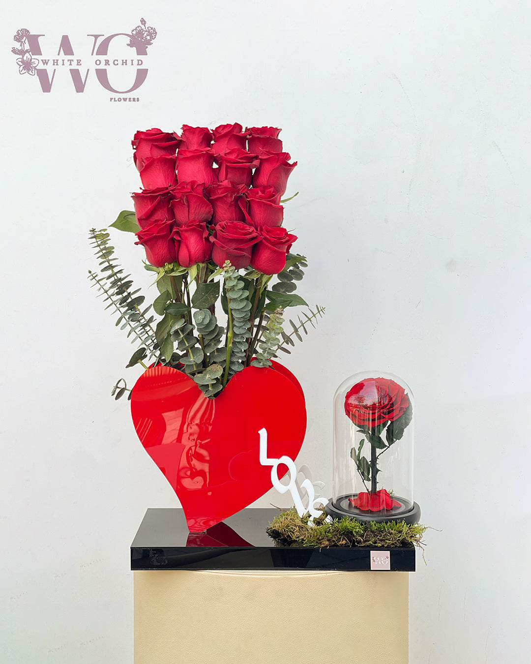 Valentine infinity rose arranged in a heart shape on a LOVE base by White Orchid Flowers – romantic preserved flower gift with delivery across all UAE.