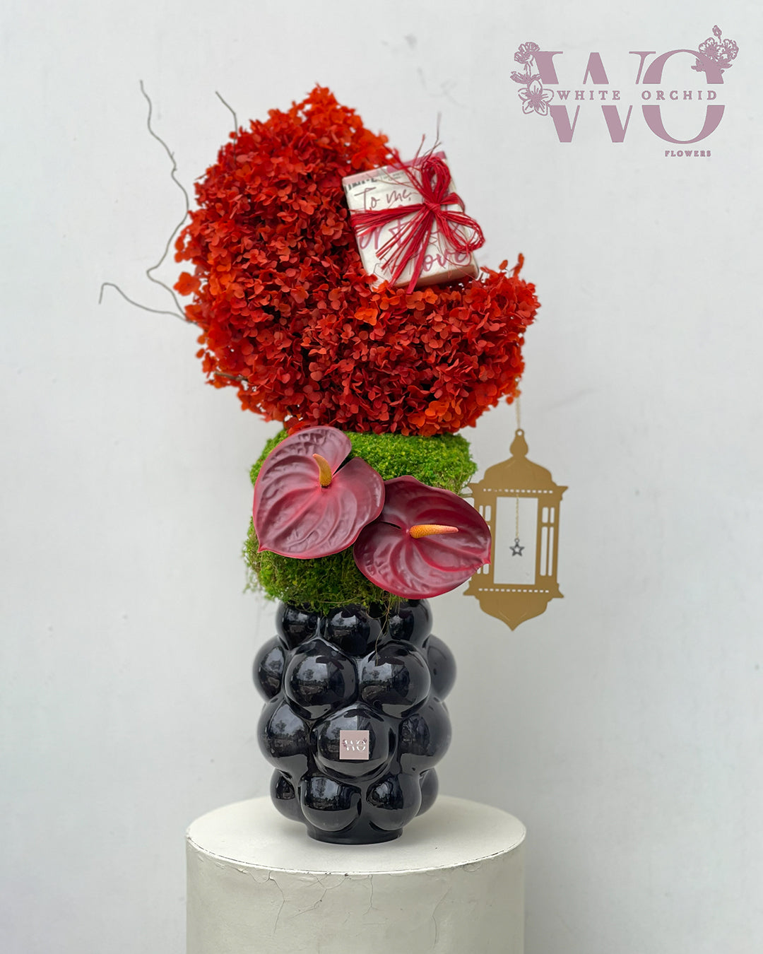 Ramadan flower arrangement with red flowers and anthurium in decorative vase by White Orchid Flowers UAE.