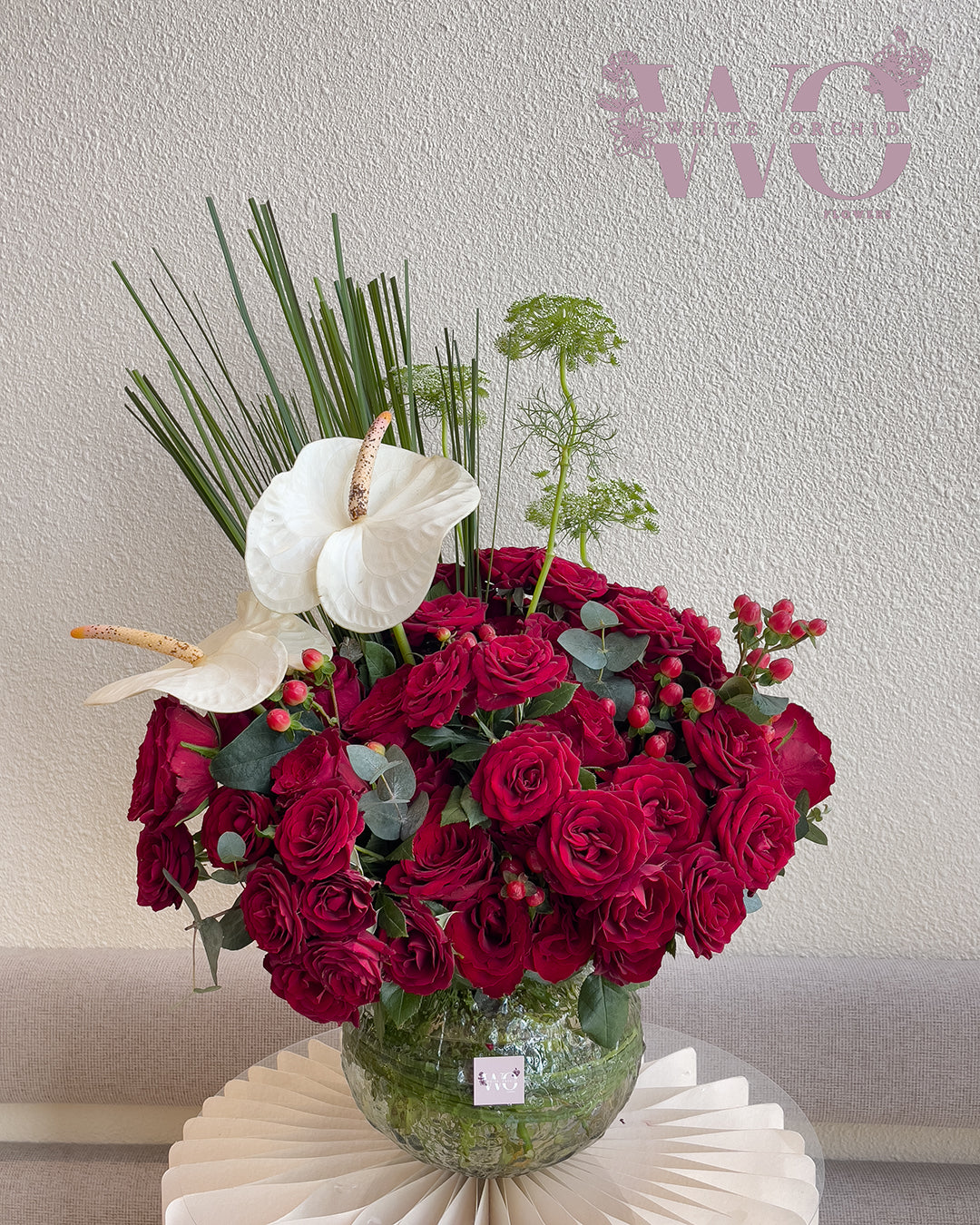 Valentine red roses arranged in a glass vase by White Orchid Flowers – romantic floral display with delivery across all UAE.
