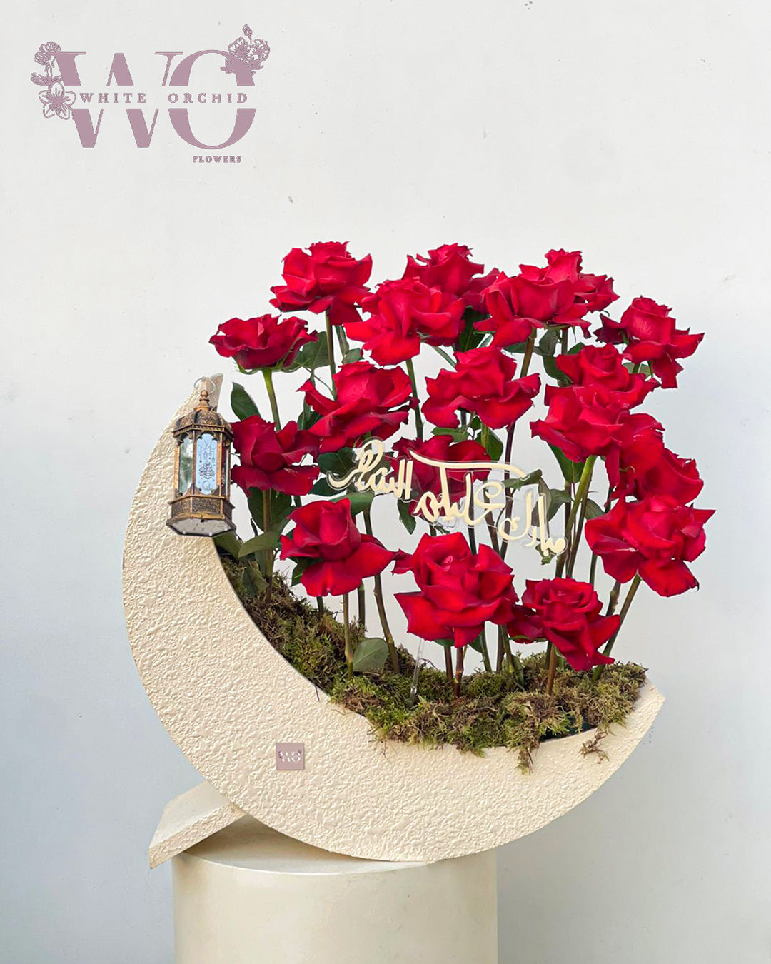 Ramadan crescent flower arrangement made with natural fresh red roses by White Orchid Flowers with delivery across all UAE.