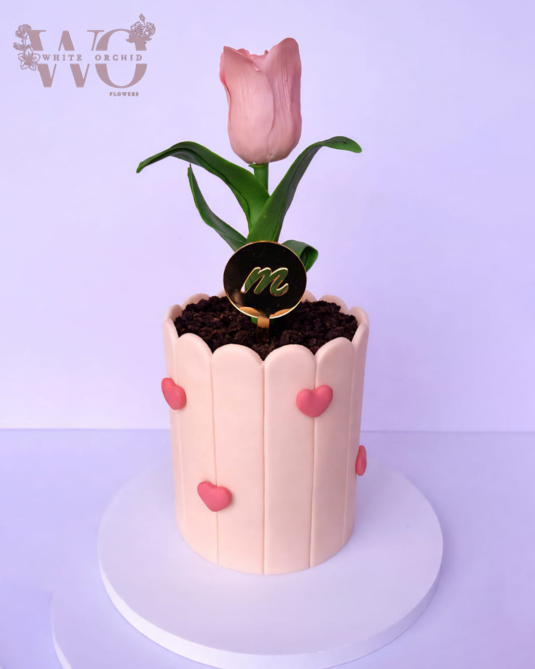 Mother’s Day cake with pink floral tulip design and elegant decoration by White Orchid Flowers UAE.
