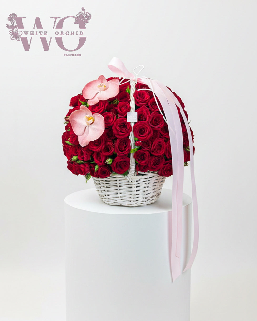 Valentine rose basket made with natural fresh roses by White Orchid Flowers – romantic floral arrangement with delivery across all UAE.