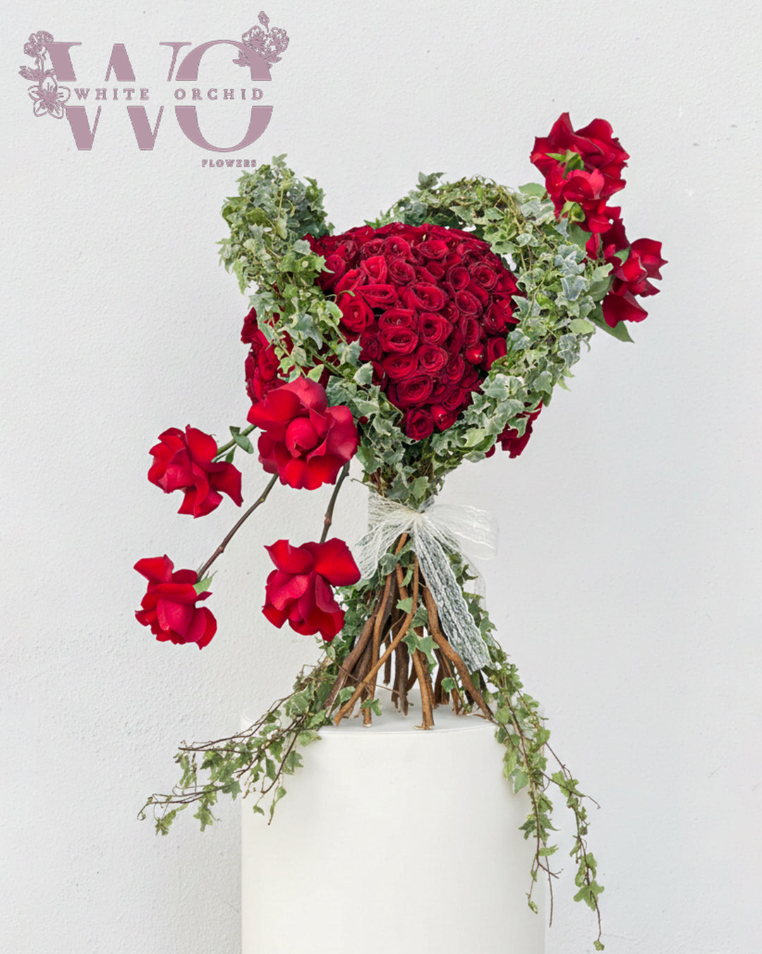 Heart-shaped Valentine flower bouquet made with natural fresh flowers by White Orchid Flowers – romantic floral design with delivery across all UAE.