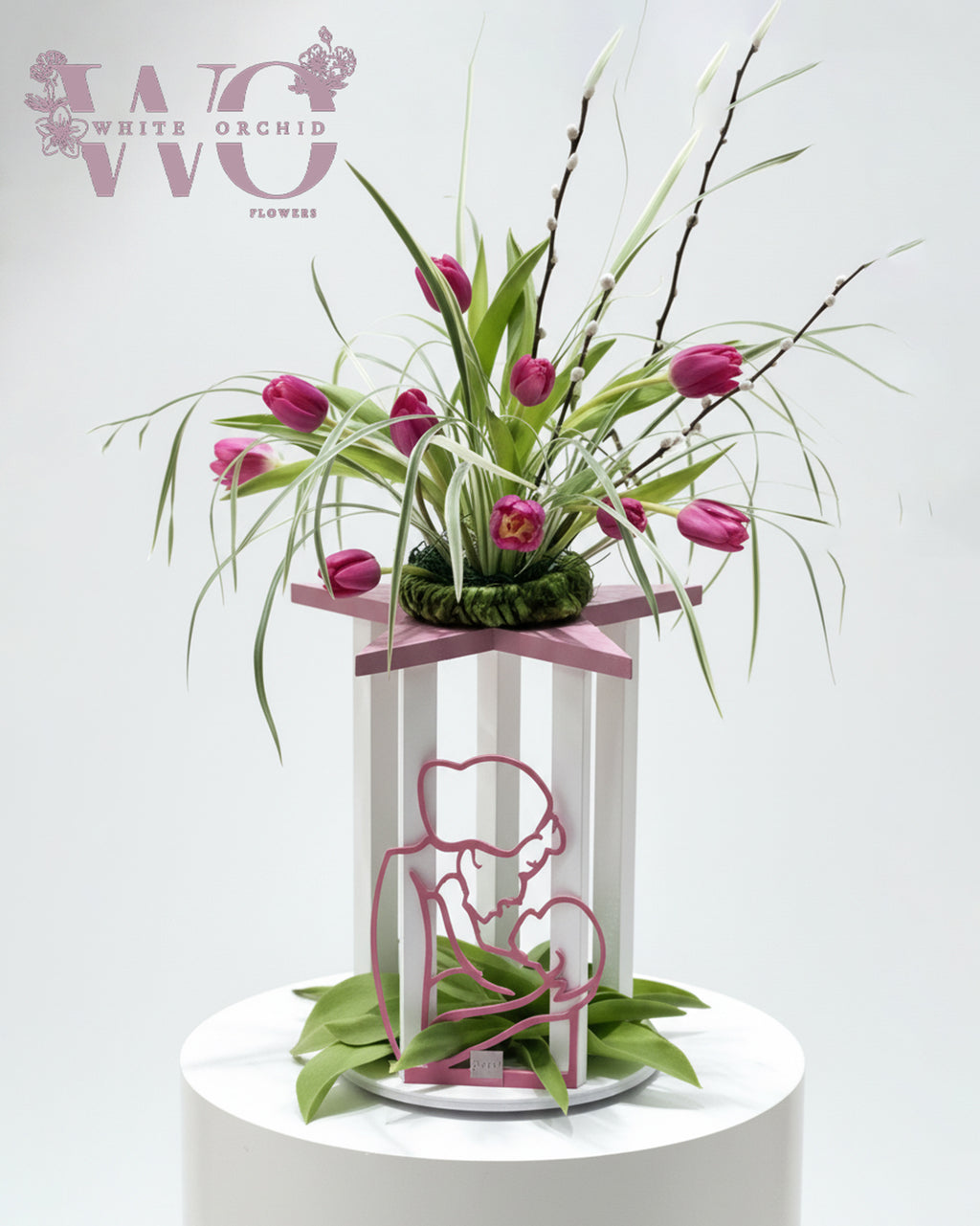 Mother’s Day tulip flower arrangement with artistic mother design by White Orchid Flowers UAE.