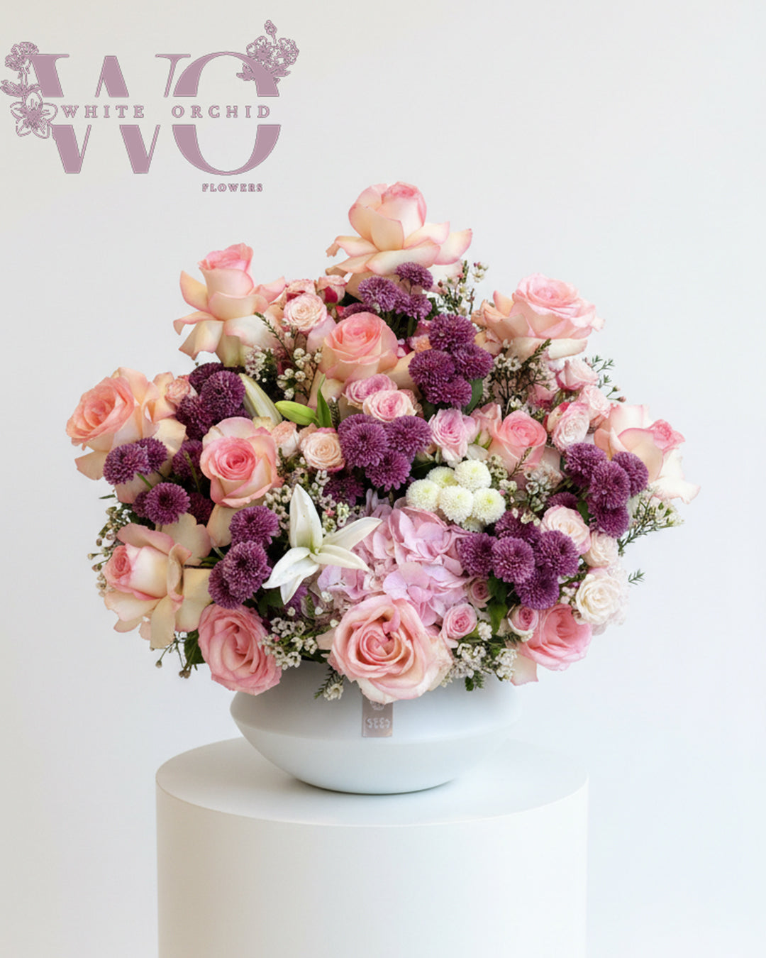 Valentine purple and pink flower bouquet made with natural fresh flowers by White Orchid Flowers – romantic floral gift with delivery across all UAE.