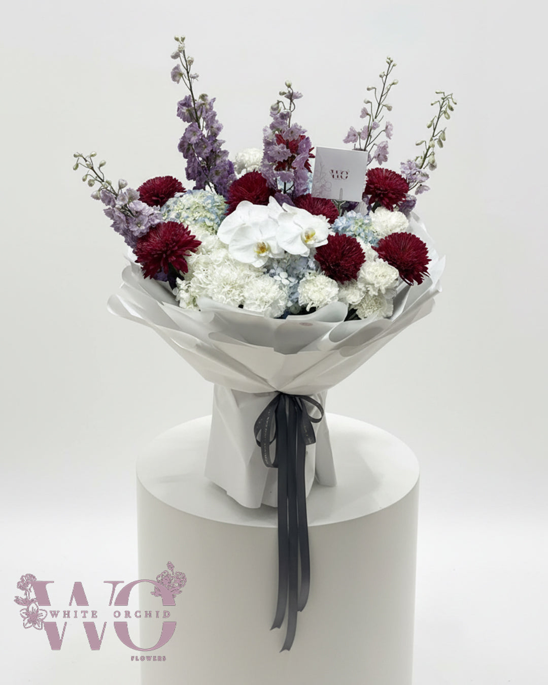 Luxury mixed flower bouquet with white orchids, hydrangea and seasonal flowers by White Orchid Flowers UAE.