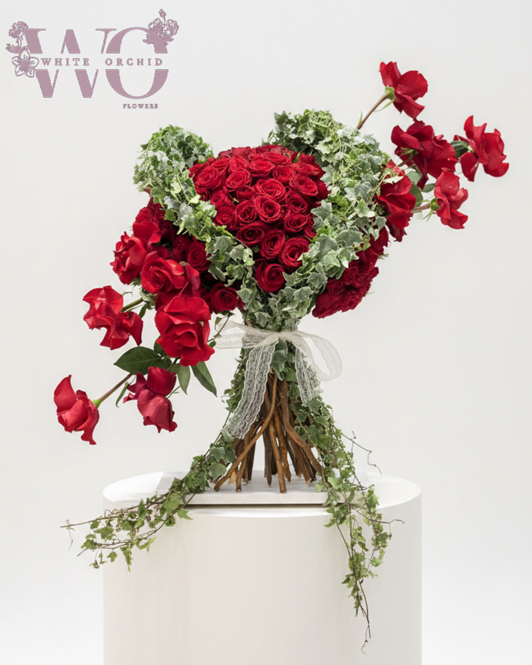 Valentine red flower bouquet made with natural fresh flowers by White Orchid Flowers – romantic floral gift with delivery across all UAE.